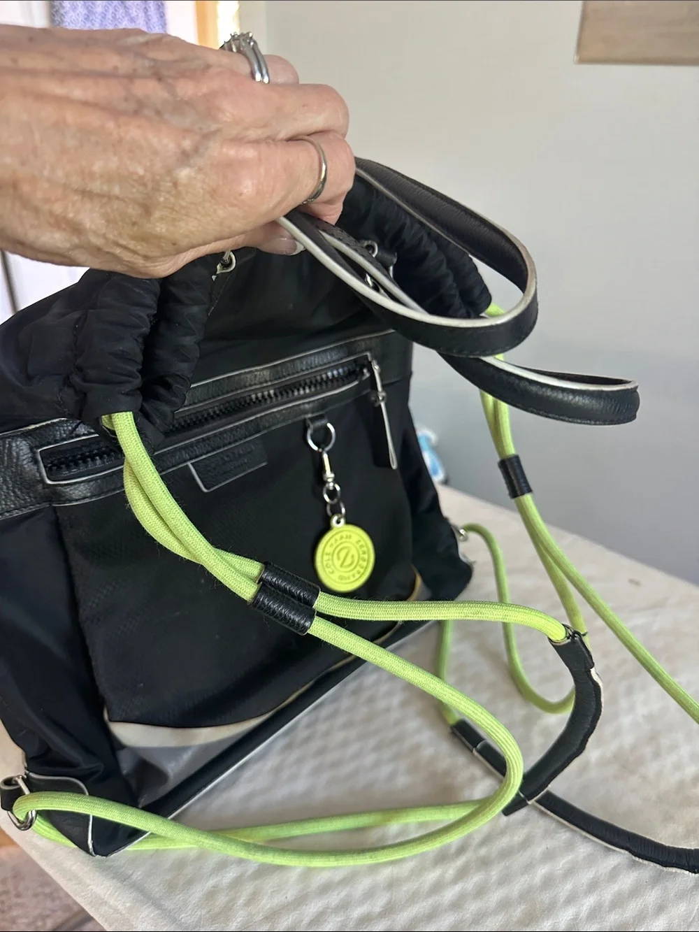 Cole Haan Zerogrand Convertible Nylon Backpack Tote in black with lime green